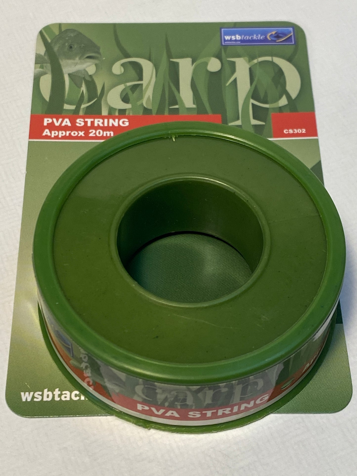 Green spool of PVA string on a white background