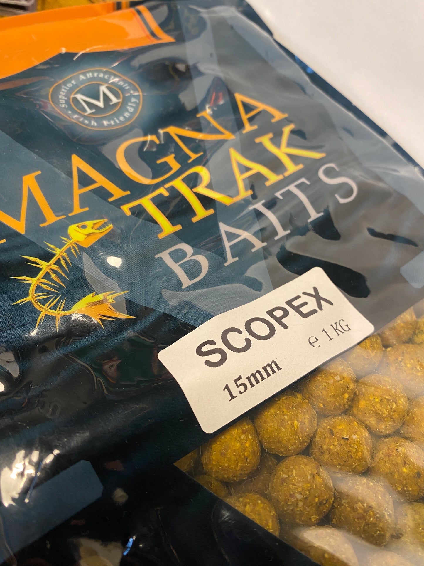 Bag of Scopex flavour boilies with a label on a white background