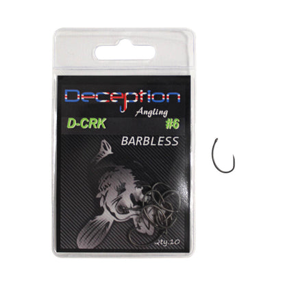 A packaged fishing hook on a plain white background. The hook is inside a clear plastic blister pack with a black backing card labeled 'Deception Angling D-CRK Barbless #6'.
