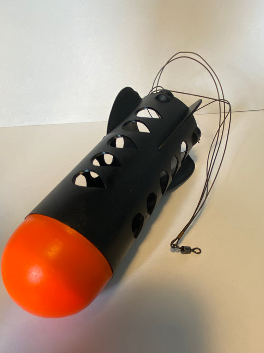 Black and orange spod rocket on a white background