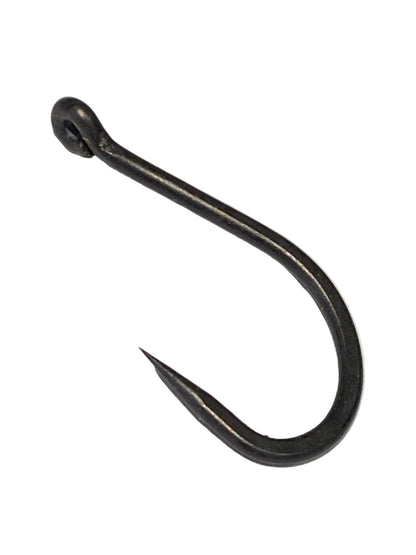 A single black metal fishing hook with a split ring eye, photographed on a textured white background.